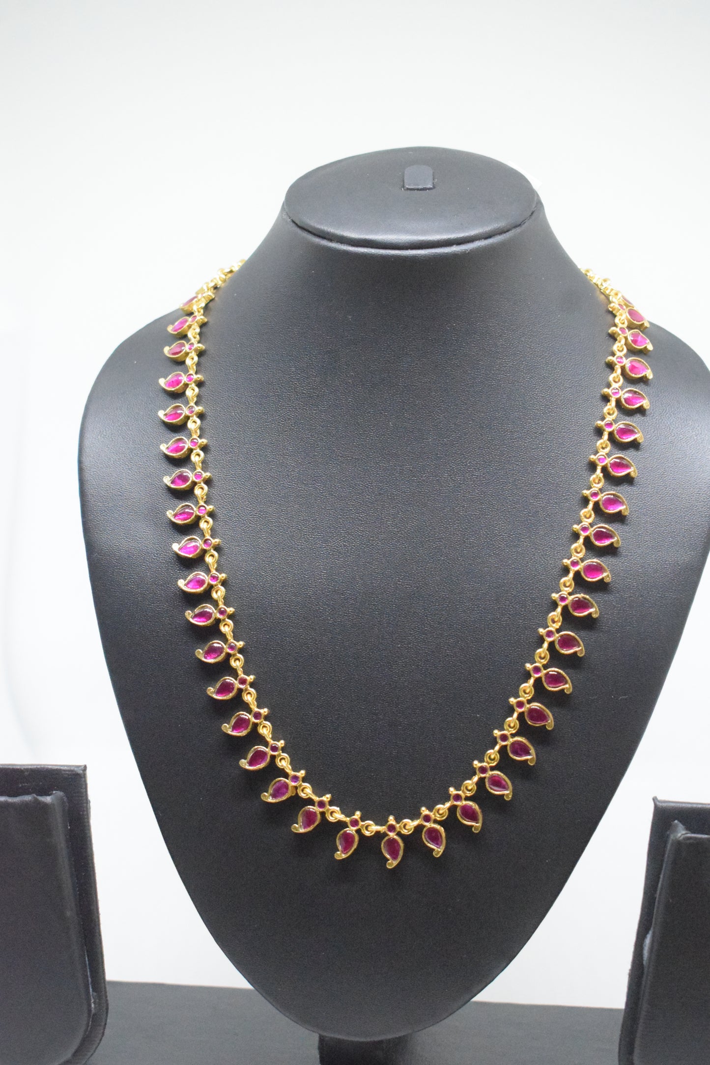 Jadau kundan long mango ruby haram.