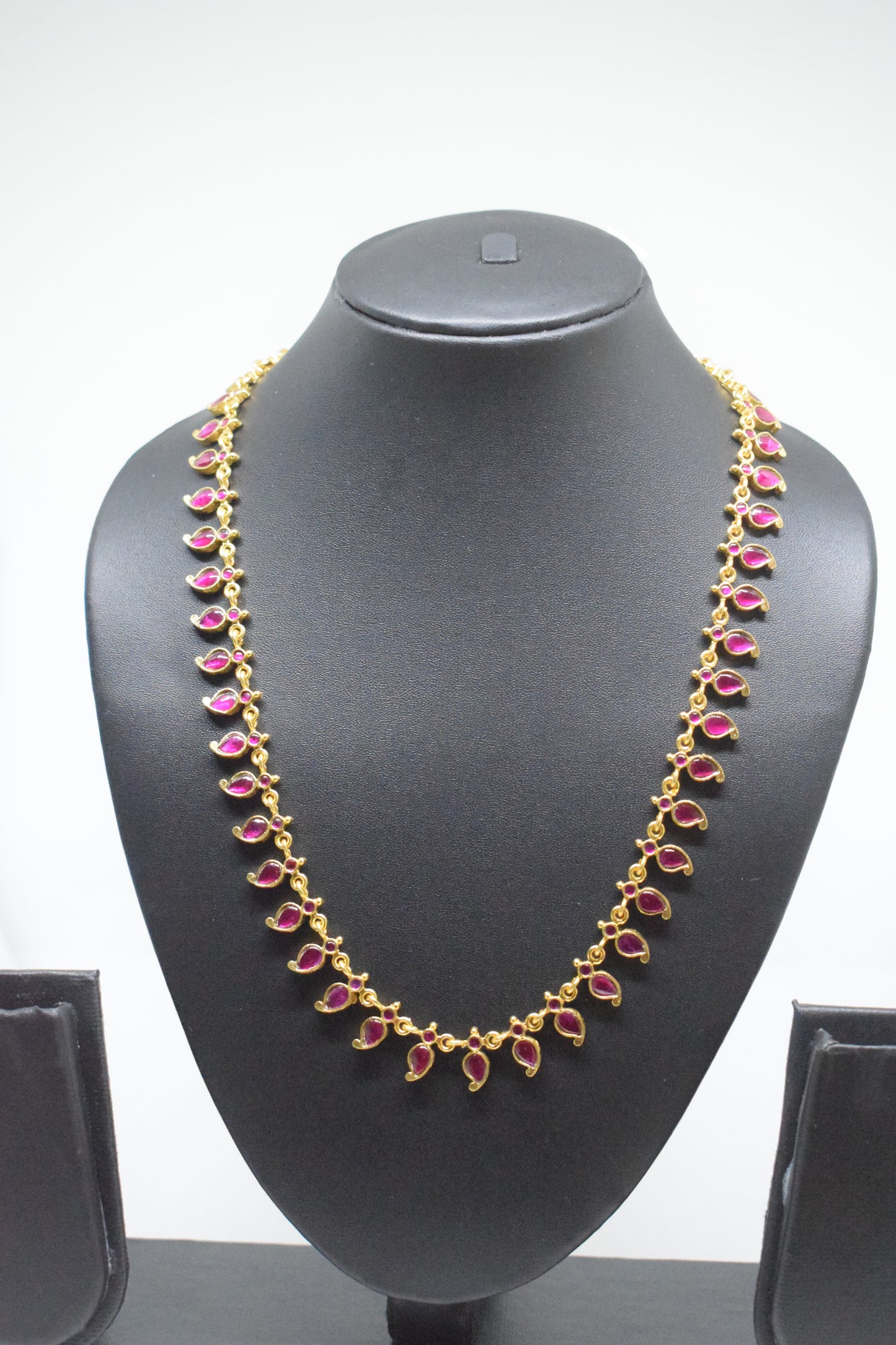 Jadau kundan long mango ruby haram.